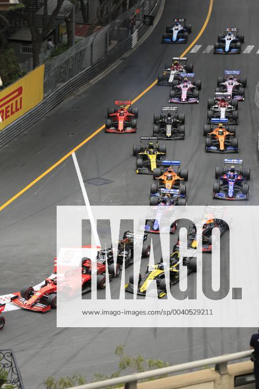 Driver field of the Formula 1 Grand Prix in the Principality of Monaco shortly after the start at the end of the start home straight and before the Ste Devote curve, Cote d Azur, Mediterranean Sea