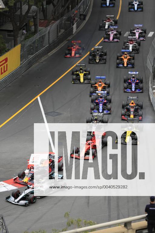 Driver field of the Formula 1 Grand Prix in the Principality of Monaco shortly after the start at the end of the start home straight and before the Ste Devote curve, Cote d Azur, Mediterranean Sea