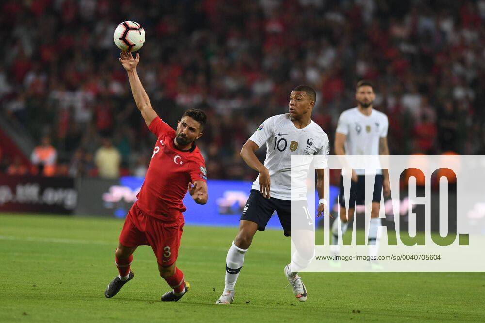 Turkeys Hasan Ali Kaldirim and Frances Kylian Mbappe during Euro 2020 group H qualifying soccer match between Turkey and France at the Konya City Stadium in Konya, Turkey