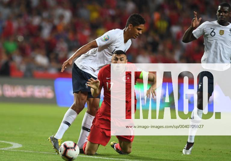 Frances Raphael Varane and Turkeys Burak Yilmaz during Euro 2020 group H qualifying soccer match between Turkey and France at the Konya City Stadium in Konya, Turkey
