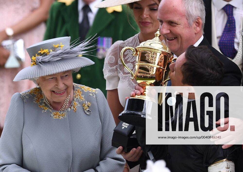 KW25 20th June 2019, Ascot Racecourse, Windsor, England; Royal Ascot Horse Racing; Race 4, Gold Cup; Frankie Dettori kisses the Gold Cup as HM The Queen looks on ActionPlus12145887 SimonxWest