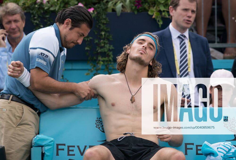KW25 Stefanos Tsitsipas of Greece receives treatment on an apparent shoulder injury during the FEVER-TREE Tennis Championships 2019 at The Queen s Club, London, England on 21 June 2019.