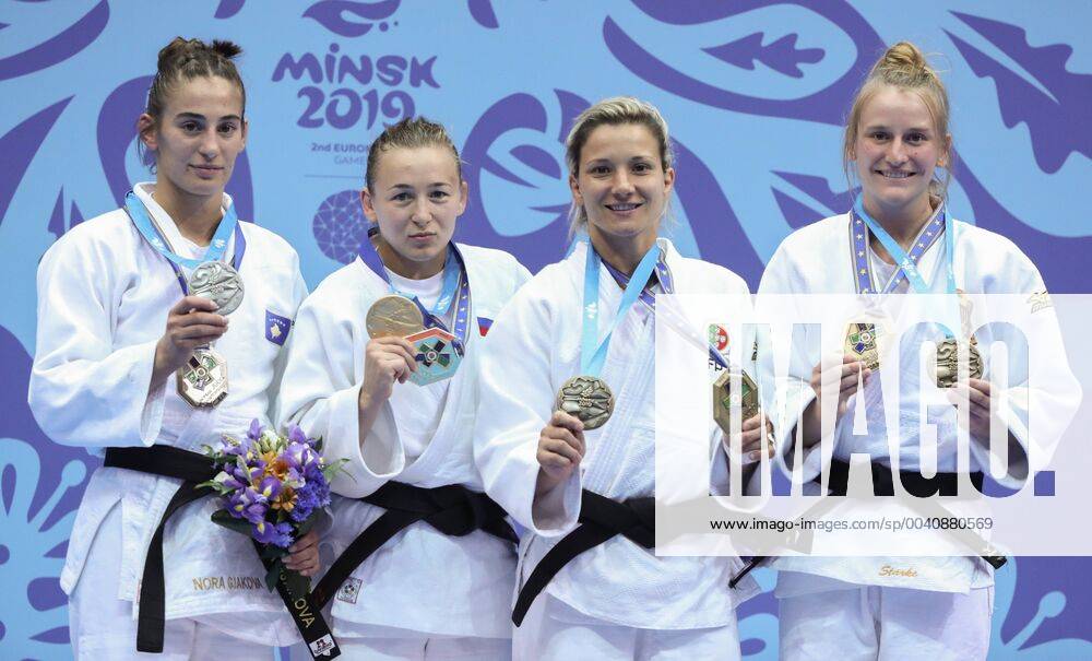 KW25 MINSK, BELARUS - JUNE 22, 2019: Silver medalist, Kosovo s Nora Gjakova, Gold medalist, Russia s Daria Mezhetskaya and Bronze medalists, Portugal s Telma Monteiro, Germany s Pauline Starke (L-R) during an award ceremony for the women s light weight (-57kg) judo event at the 2nd Europaspiele Natalia Fedosenko TASS TS0B08DD