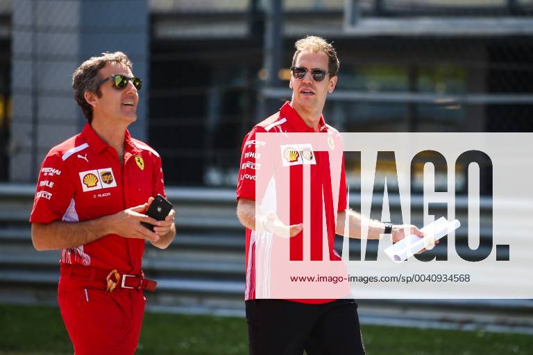 FORMULA 1 - GP of Austria 2019 SPIELBERG,AUSTRIA,27.JUN.19 - MOTORSPORTS, FORMULA 1 - Grand Prix of Austria, Red Bull Ring, preview. Image shows Sebastian Vettel (GER Ferrari) and an engineer. GEPAxpictures xDanielxGoetzhaber