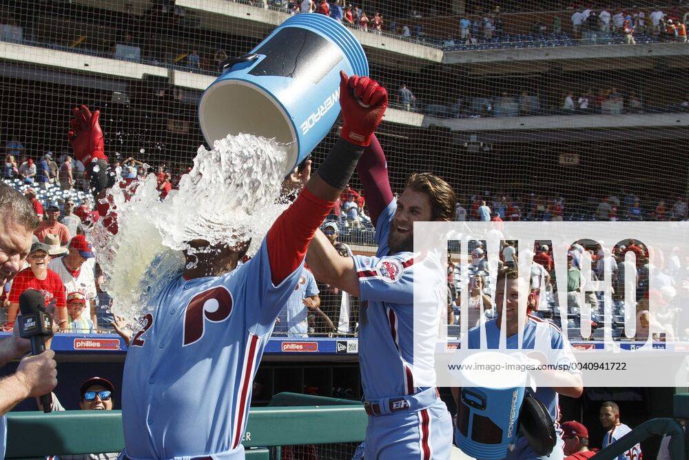 Philadelphia Phillies shortstop Jean Segura (2) gets doused by right fielder Bryce Harper (3) as they celebrate the walk off win following the MLB, Baseball Herren, USA game between the New York Mets and Philadelphia Phillies at Citizens Bank Park in Philadelphia, Pennsylvania. Christopher Szagola CSM MLB 2019: Mets vs Phillies JUN 27 - ZUMAcs7_ 20190627_zaf_cs7_014