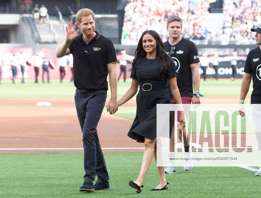KW26 The Duke and Duchess of Sussex Prince Harry and Meghan walk on the field when the New York Yankees play the Boston Red Sox at the London Stadium in the Queen Elizabeth Olympic Park in London on Saturday June 29, 2019. Europe s first ever Major League Baseball game is played at the London Stadium. LON20190629394 MARKxTHOMAS