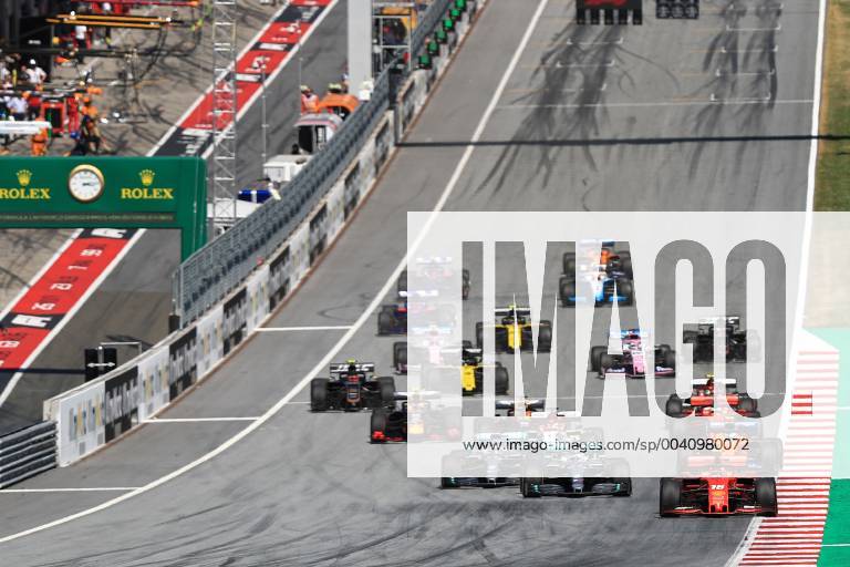 30th June 2019, Red Bull Ring, Spielberg, Austria; FIA Formula 1 Grand Prix, Race Day; Scuderia Ferrari, Charles Leclerc leads race start with Mercedes AMG Petronas Motorsport, Lewis Hamilton making a move on the inside of the circuit ActionPlus12149382 Octane