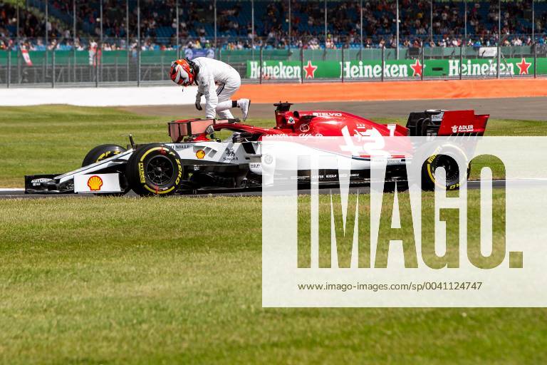 12th June 2019, Silverstone, Northampton, England; F1 Grand Prix of Great Britain, Practice sessions; Alfa Romeo Racing driver Kimi Raikkonen jumps out of his broken down car ActionPlus12153058 TimxWilliams