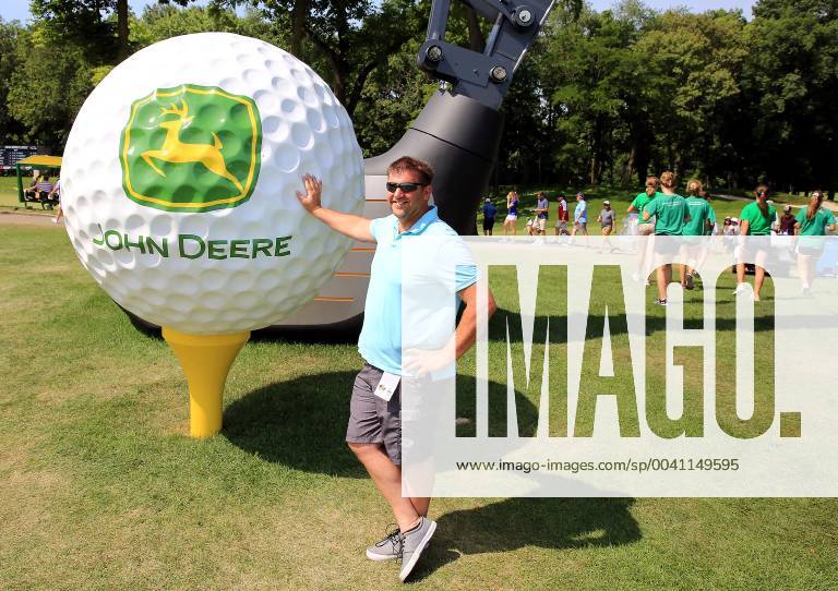 Silvis, Iowa, USA - J.D. Mudd of Colona, Illinois was one of the thousands of golf fans to pose with the John Deere giant golf ball near the 9th green during the third round of the John Deere Classic at TPC Deere Run in Silvis, Illinois Saturday, July 13, 2019. Golf 2019: John Deere Classic Iowa - ZUMAq30_ 20190713_zaf_q30_019