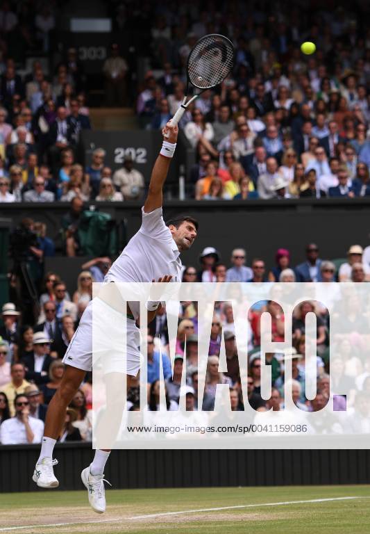 (190714) -- LONDON, July 14, 2019 -- Novak Djokovic of Serbia serves during the men s singles final match between Novak Djokovic of Serbia and Roger Federer of Switzerland at the 2019 Wimbledon Tennis Championships in London, Britain, July 14, 2019. ) (SP)BRITAIN-LONDON-TENNIS-WIMBLEDON CHAMPIONSHIPS 2019-MEN S SINGLES-FINAL LuxYang