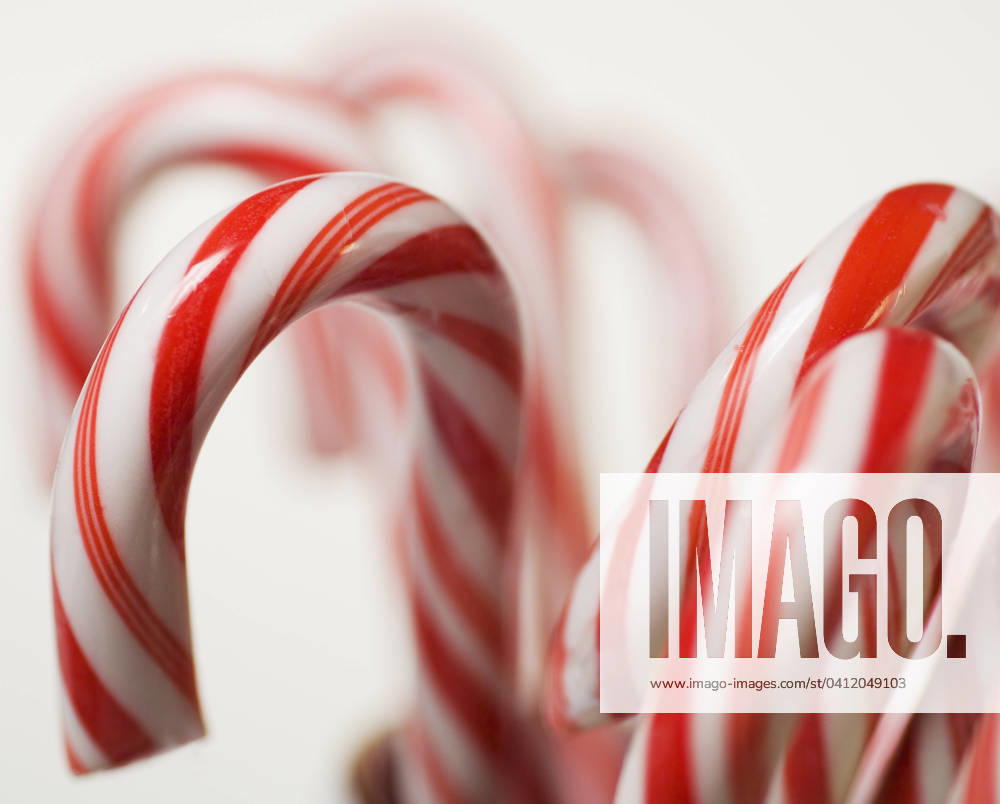 Closeup of candy canes , 12.01.2006, TTBB_ti0119483.jpg, Tetra Images, bright, candy, candy cane, candy canes, celebrate, celebrating, celebration, celebrations, Christmas, Christmastime, close up, closeup, close-up, color, colorful, festive, food, four objects, holiday, holidays, horizontal, nobody, peppermint, red and white, season, seasonal, special event, special events, special occasion, special occasions, still life, stocking stuffer, striped, stripes, studio shot, sweet, sweets, treat, treats, yummy, ti0119483