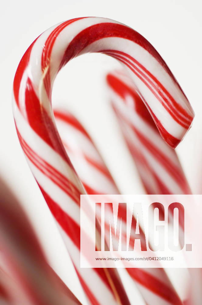 Closeup of candy canes , 12.01.2006, TTBB_ti0119486.jpg, Tetra Images, bright, candy, candy cane, candy canes, celebrate, celebrating, celebration, celebrations, Christmas, Christmastime, close up, closeup, close-up, color, colorful, festive, food, four objects, holiday, holidays, nobody, peppermint, red and white, season, seasonal, special event, special events, special occasion, special occasions, still life, stocking stuffer, striped, stripes, studio shot, sweet, sweets, treat, treats, vertical, yummy, ti0119486