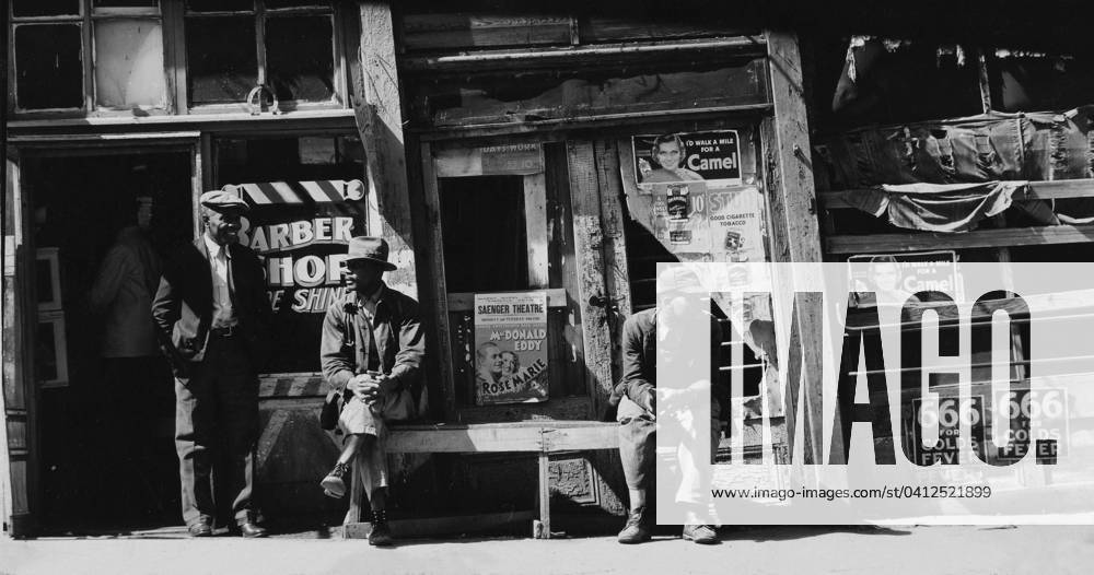 Vicksburg african-american men and shop front. Mississippi 1936 2683650 Vicksburg african-american men and shop front. Mississippi 1936 by Evans, Walker (1903-75); (add.info.: United States. Farm Security Administration Evans, Walker, 1903-1975 (Photographer)); PVDE.