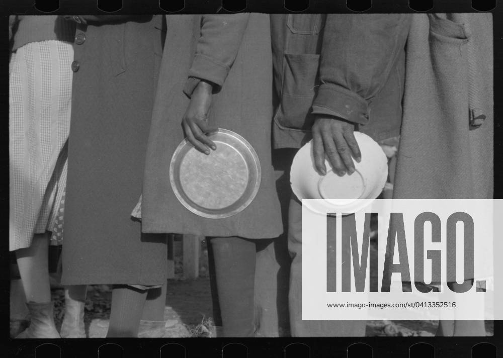African Americans in the lineup for food at mealtime in the camp for flood refugees, Forrest City, Arkansas, 1937 (b w photo) 3666435 African Americans in the lineup for food at mealtime in the camp for flood refugees, Forrest City, Arkansas, 1937 (b w photo) by Evans, Walker (1903-75); Private Collection; (add.info.: Photograph taken for the U.S. Resettlement Administration: a New Deal U.S. federal agency that, between April 1935 and December 1936, relocated struggling urban and rural families to communities planned by the federal government.).
