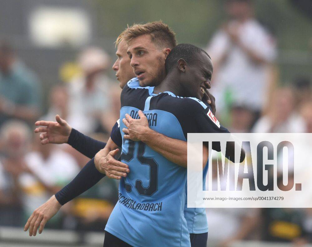 Test match Borussia Mönchengladbach SCO Angers France 27 07 2019 Famana Quizera embraces goalscorer Patrick Herrmann BMG , behind Oscar Wendt DFL REGULATIONS PROHIBIT ANY USE OF PHOTOGRAPHS AS IMAGE SEQUENCES AND OR QUASI VIDEO HM