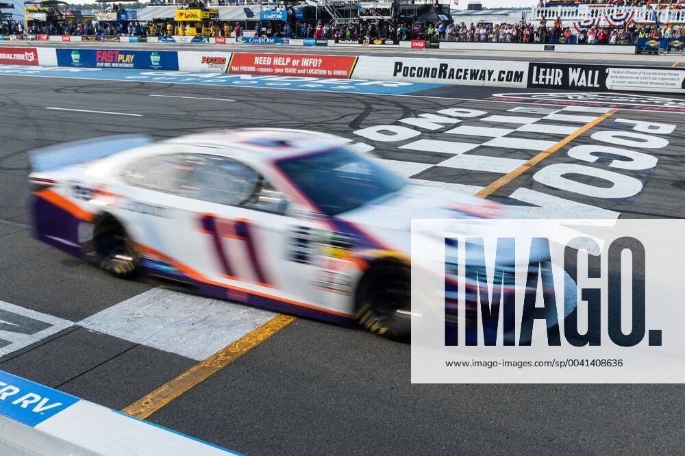 KW30 LONG POND, PA - JULY 28: Denny Hamlin driver of the 11 FedEx Ground Toyota crosses the strip to win the Monster Energy NASCAR, Motorsport, USA Cup Series, Gander Outdoors 400 on July 28, 2019, at Pocono Raceway in Long Pond, PA. (Photo by David Hahn Icon Sportswire) AUTO: JUL 28 Monster Energy NASCAR Cup Series - Gander Outdoors 400 Icon190728036400