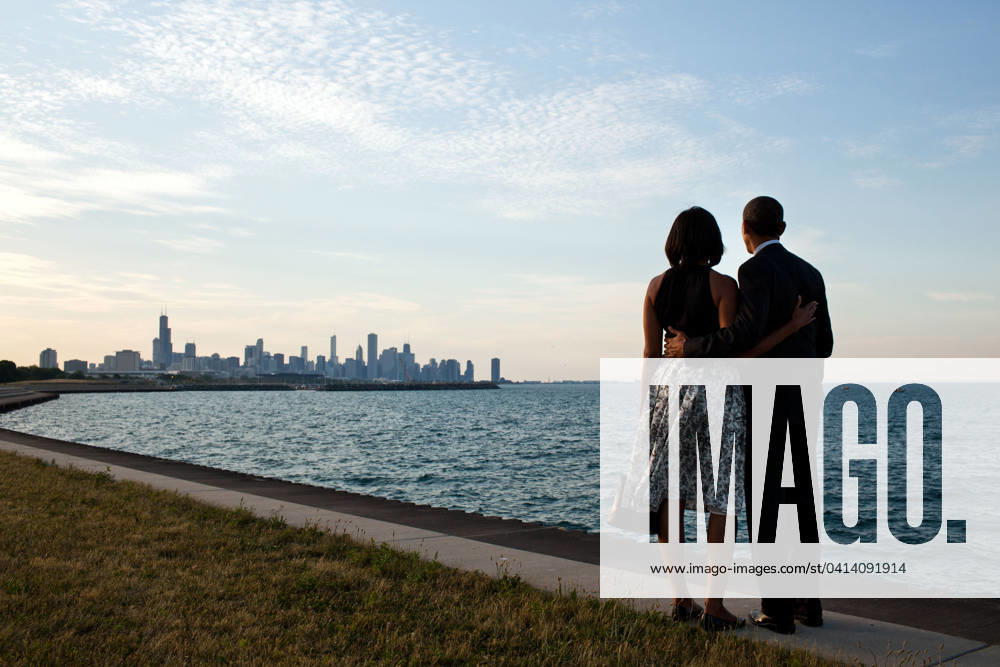 With Michelle in Chicago June 15, 2012. We had just arrived at the helicopter landing zone in Chicago and instead of walking right to the motorcade, the President and First Lady walked past their vehicle to the edge of Lake Michigan to view the skyline of their home town. .Mandatory Credit: Pete Souza - White House via CNP Chicago Illinois United States of America