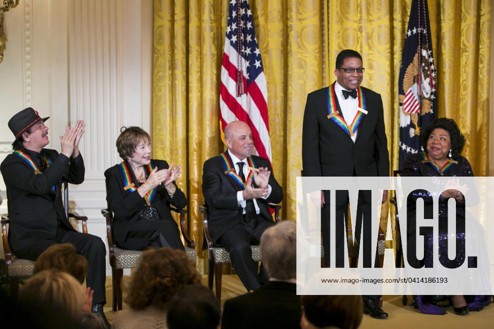 Obama Hosts Kennedy Center Honorees At The White House 2013 Kennedy Center Honorees (L to R) Carlos Santana, Shirley MacLaine, Billy Joel, Herbie Hancock and Martina Arroyo attend a reception at the White House prior to the Kennedy Center ceremony on December 8, 2013 in Washington, DC. Credit: Kristoffer Tripplaar Pool via CNP Washington District of Columbia United States of America