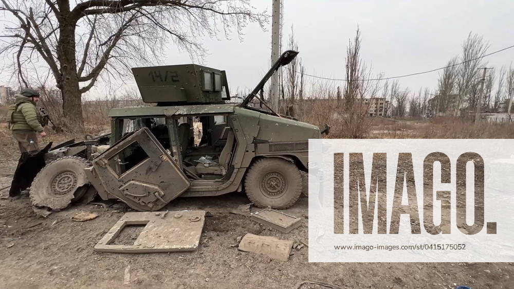 A field engineer of the Tsenr group of the Russian Armed Forces searches for land mines near a damaged military vehicle in the city of Avdeyevka. Video grab. Best quality available. Russian Defence Ministry TASS 67459855