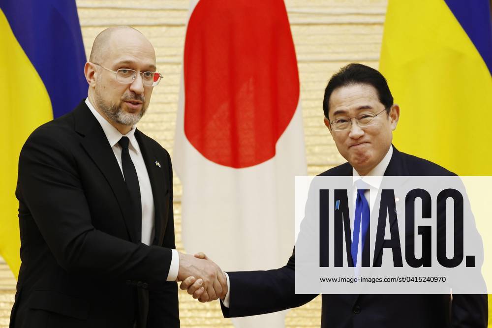 KW08 Japan, Ukraine prime ministers Japanese Prime Minister Fumio Kishida (R) shakes hands with his Ukrainian counterpart Denys Shmyhal after their joint press conference at the premier s office in Tokyo on Feb. 19, 2024. A14AA0002485252P