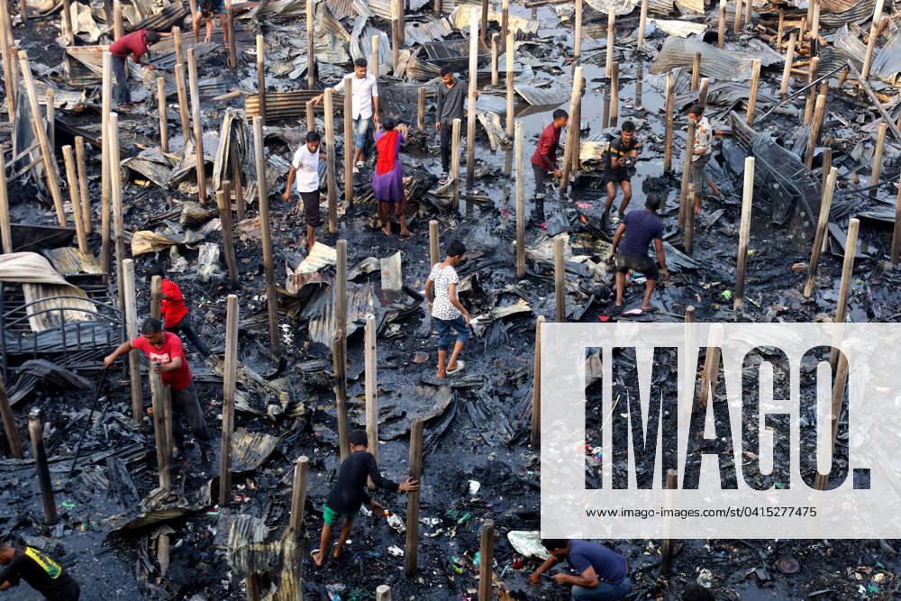 A fire broke out in the Jhilpar slum of Mirpur, Dhaka today at noon. About 200 tin shed houses were completely burnt down. 8 units of fire service brought the fire under control in an hour. Slum dwellers try to find their last belongings from the burnt slums. Dhaka Bangladesh - ZUMAk174 20240219_zip_k174_003