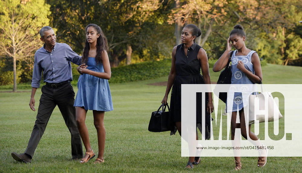 The First Family Returns to the White House United States President Barack Obama (L), daughters Sasha (2nd L), Malia (R) and wife Michelle arrive at the White House in Washington, D.C on August 23, 2015 upon their return from vacationing at Martha s Vineyard. Credit: Olivier Douliery Pool via CNP Washington District of Columbia United States of America