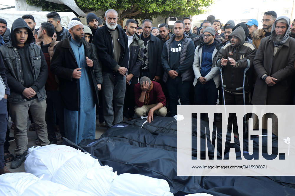 Relatives of the Palestinians died in Israeli attacks, mourn as they receive the dead bodies from the morgue of Al-Aqsa Relatives of the Palestinians died in Israeli attacks, mourn as they receive the dead bodies from the morgue of Al-Aqsa Hospital for burial in Dair El-Balah, Gaza Strip, 21 February 2024. Photo by Naaman Omar apaimages Dair El-Balah Gaza Strip Palestinian Territory 210224_Dair_El-Balah_NAA_1_00(36)