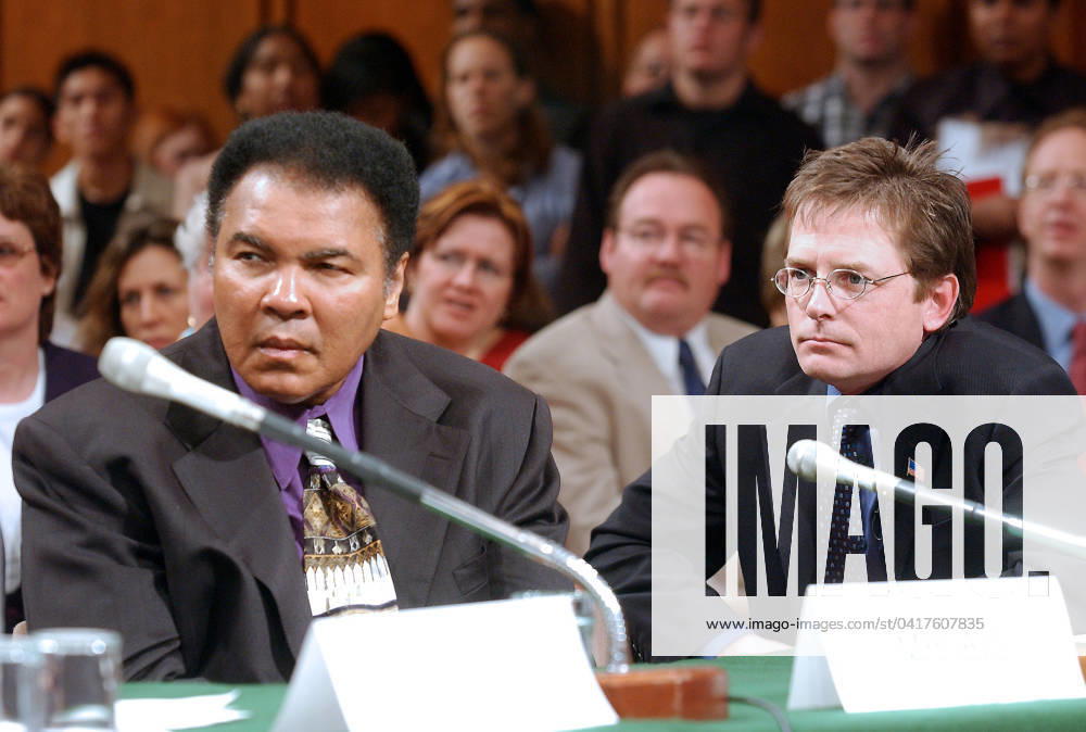 Mohammad Ali, left and Michael J. Fox, right, testify during the United States Senate Appropriations Subcommittee on Labor and HHS hearing on Parkinson s Disease in Washington, DC on May 22, 2002. Both the Champ and Mr. Fox advocated for increased funding to the National Institutes of Health (NIH) for Parkinson s research. Credit: Ron Sachs CNP