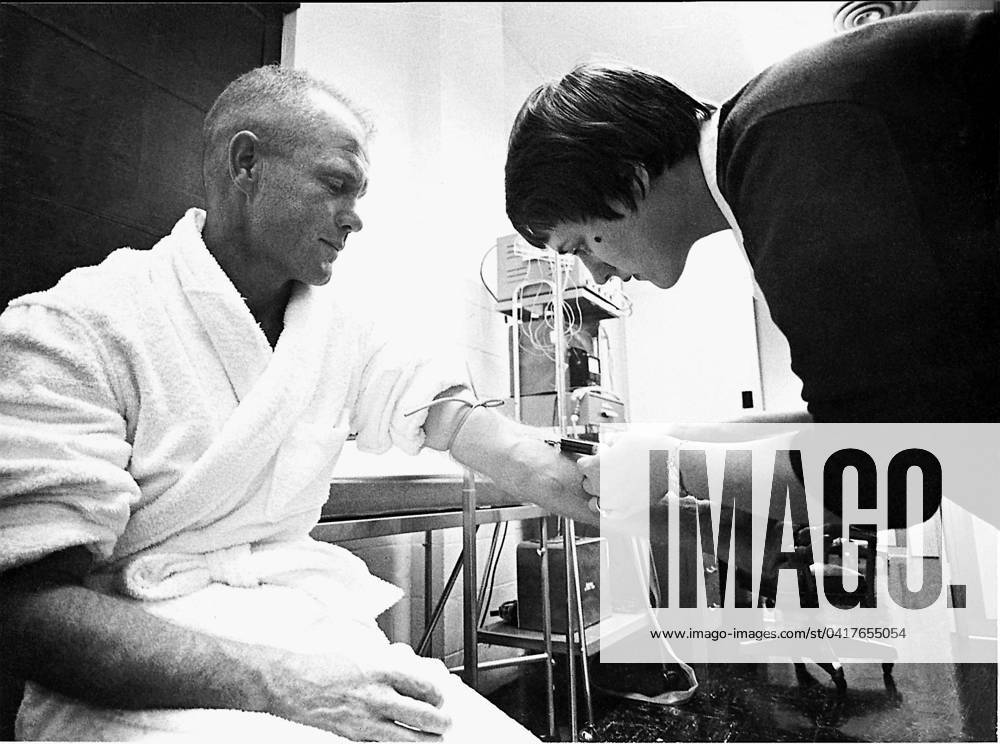 Glenn Blood Test Mercury astronaut John H. Glenn Jr. has a blood sample taken by Astronaut Nurse Delores B. O Hara, R.N., in the Aeromedical Laboratory at Cape Canaveral, Florida on July 5, 1961. .Credit: NASA via CNP Cape Canaveral Florida United States of America