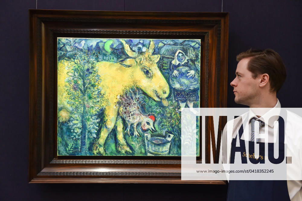 Sotheby s staff member looks at Marc Chagall s La ferme, le village estimated at 1,500,000 - 2,000,000 GBP during the preview of Sothebyâ€⠢s first major modern & contemporary art auctions of 2024. London United Kingdom - ZUMAk172 20240228_zip_k172_047