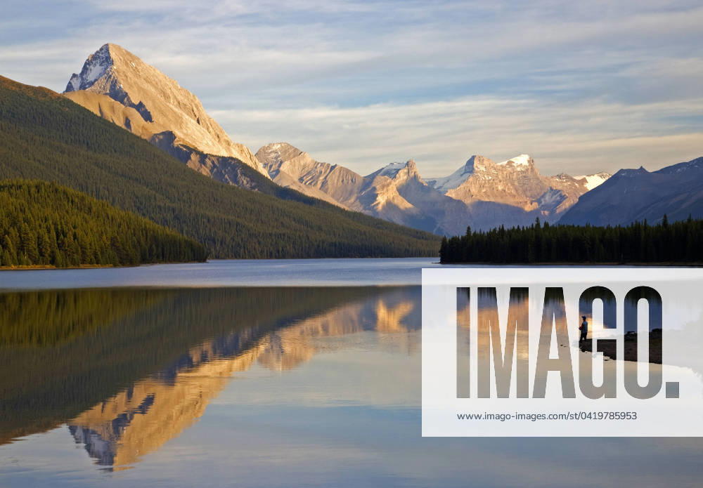 Male fly fisherman at Maligne Lake, Jasper National Park, Alberta, Canada.
