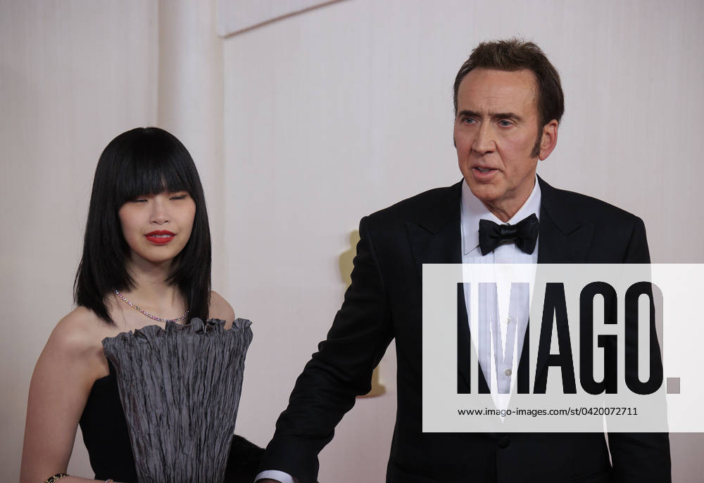 Riko Shibata and Nicolas Cage on the red carpet of the 96th Annual Academy Awards on Sunday March 10, 2024 at the Dolby Theater in Hollywood, California. BURT HARRIS BNS PI Hollywood U.S - ZUMAp124 20240310_zaa_p124_272