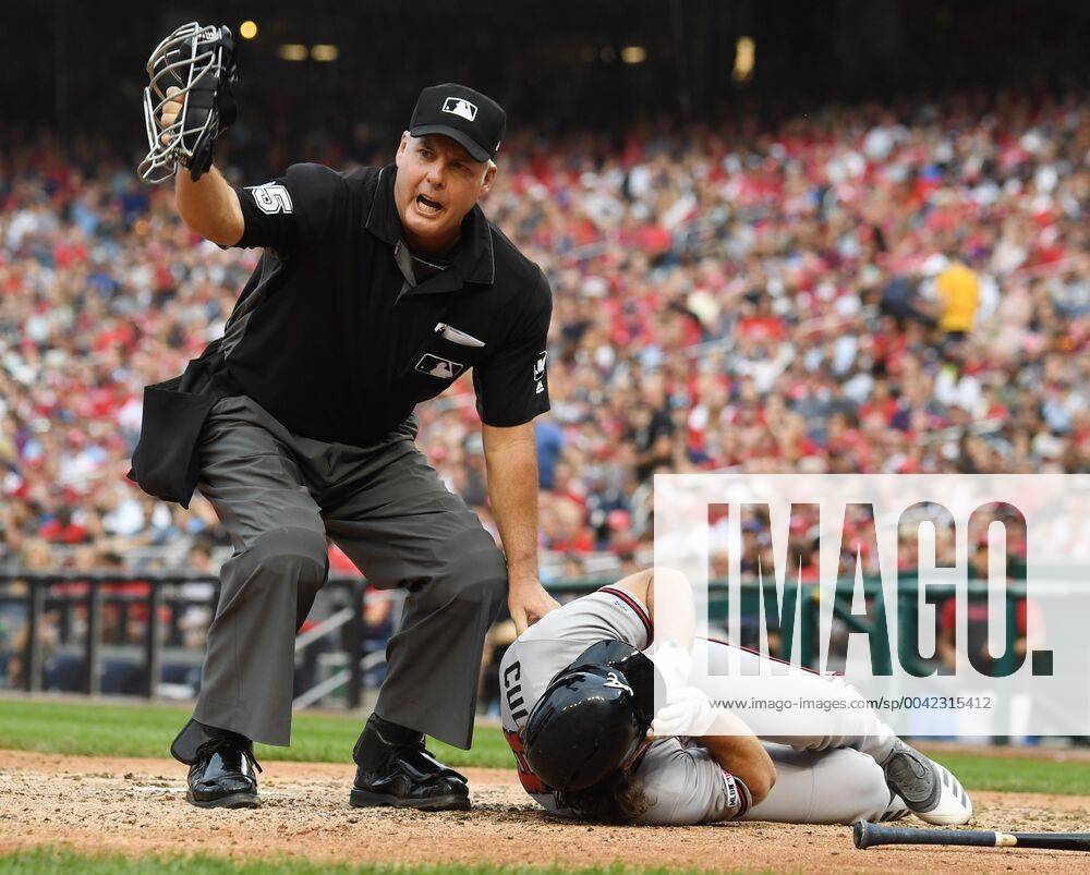 KW37 Home Plate Umpire Tim Timmons yells for help after Atlanta Braves Charlie Culberson lies on the ground after being hit by a pitch while trying to bunt by Washington Nationals Fernando Rodney in the seventh inning of game at Nationals Park in Washington, DC on Saturday, September 14, 2019. Culberson left the game. WAS20190914104 PATxBENIC