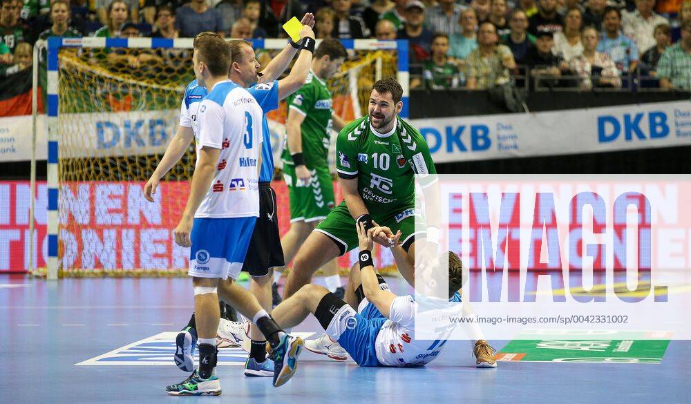 Handball, 1 Bundesliga, 5 Matchday, Foxes Berlin TVB Stuttgart, Max Schmeling Hall Berlins Jakov Gojun 2 from right receives the yellow card Handball 1 Bundesliga Foxes Berlin TVB Stuttgart