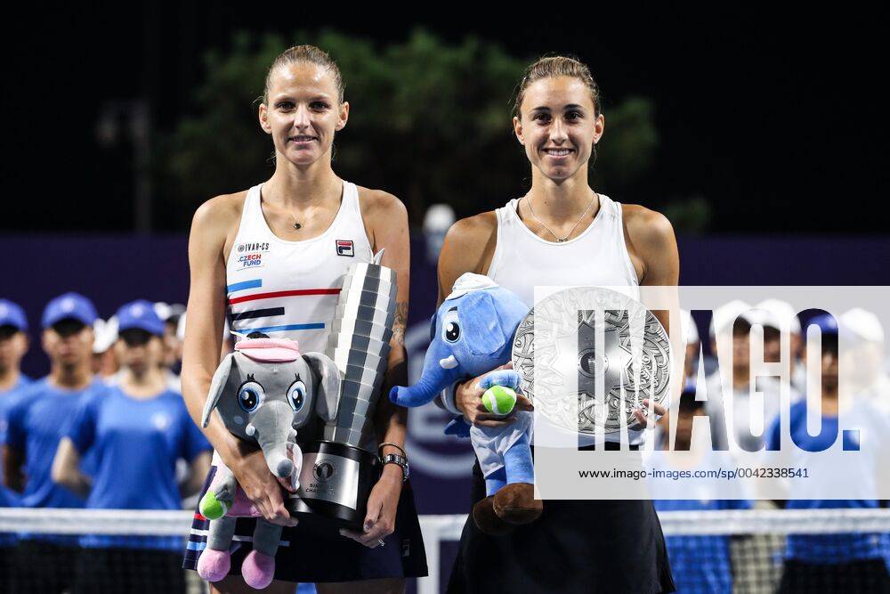 KW37 ZHENGZHOU, CHINA - SEPTEMBER 15: Karolina Pliskova (L) of Czech Republic poses with the champion trophy while Petra Martic of Croatia poses with runner-up trophy after their singles final match on day seven of Zhengzhou Open 2019 at Zhongyuan Tennis Training Base Management Center on September 15, 2019 in Zhengzhou, Henan Province of China.