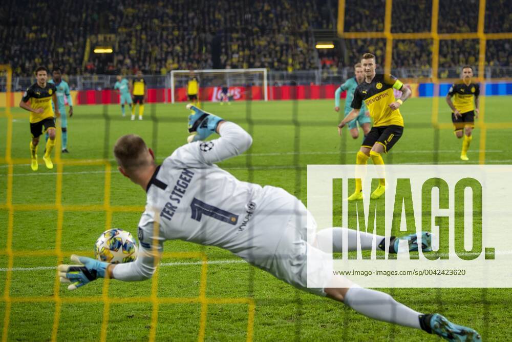 Football UEFA Champions League, CL, season 2019 2020, 1 matchday, Borussia Dortmund FC Barcelona in Dortmund North Rhine-Westphalia Barcelona goalkeeper Marc Andre ter Stegen l holds the penalty kick from Dortmunds Marco Reus UEFA REGULATIONS PROHIBIT ANY USE OF PHOTOGRAPHS AS IMAGE SEQUENCES AND OR QUASI VIDEO