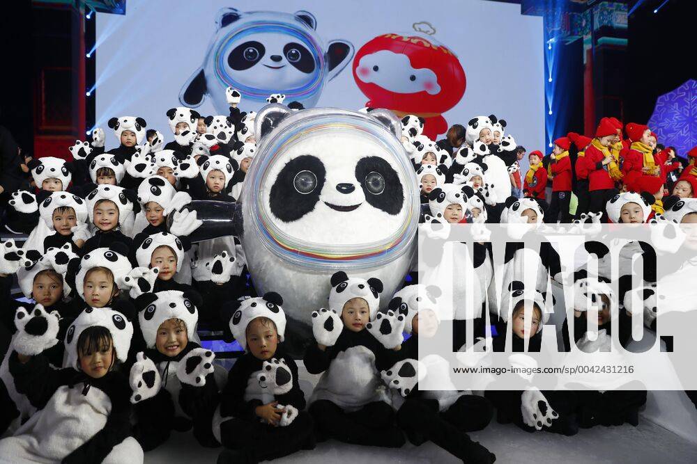 Children pose with the Mascot of the 2022 Olympic Winter games, Winterspiele,Spiele, Summer games Bing Dwen Dwen, during a launching ceremony at the Shougang Ice hockey, Eishockey Arena on September 17, 2019 in Beijing, China.