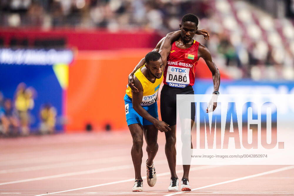 Braima Suncar Daibo helps Jonathan Busby during the men?s 5000 meter qualification during day 1 of the IAAF World Athletics Championships on September 27, 2019 in Doha Photo Joel Marklund BILDBYRAN kod JM 88031 bbeng athletics track field friidrott friidrett iaaf world athletics championships athletics world championship vm friidrotts vm friidretts vm,
