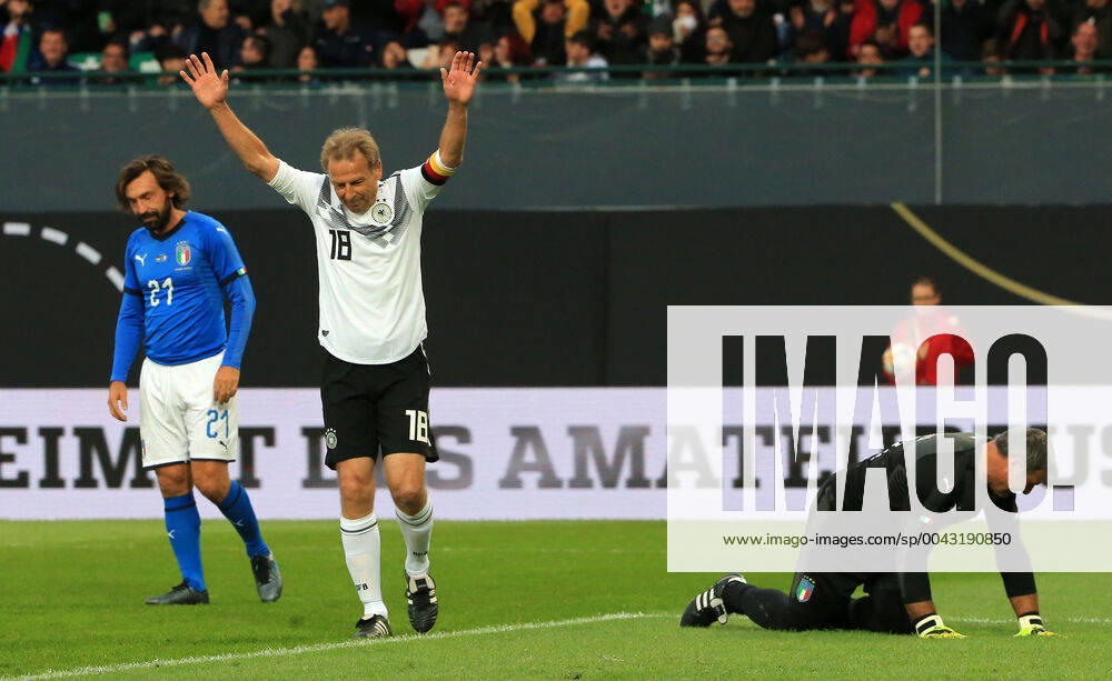DFB All Stars vs. Azzuri Legends, Sportpark Ronhof Fuerth, football, sport, in picture Andrea Pirlo Azzuri All Stars , Juergen Klinsmann DFB All Stars cheers for the 2 0, Angelo Peruzzi Azzuri All Stars on the floor