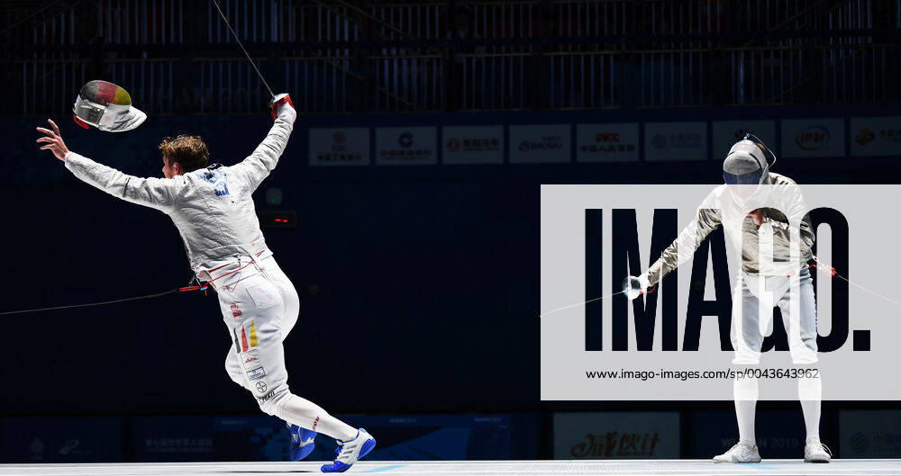 KW43 (191021) -- WUHAN, Oct. 21, 2019 -- Richard Huebers (L) of Germany celebrates after winning the men s individual sabre gold medal bout of fencing at the 7th CISM Military World Games in Wuhan, capital of central China s Hubei Province, Oct. 21, 2019. ) (SP)CHINA-WUHAN-7TH MILITARY WORLD GAMES-FENCING WangxJianwei