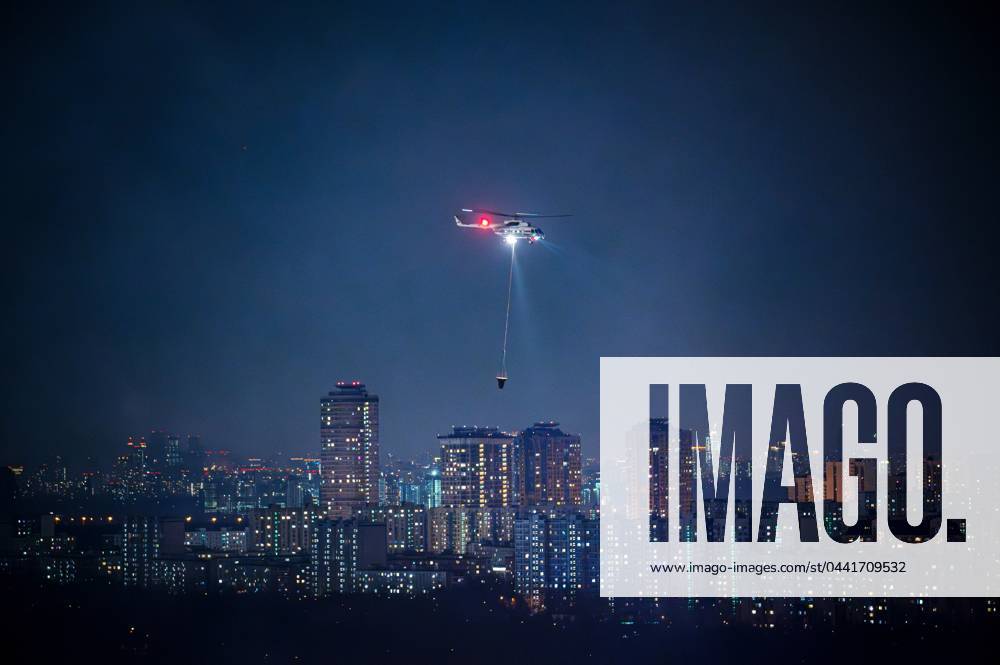 KW12 Russia Terrorist Attack 8647987 22.03.2024 Firefighters operate a helicopter as they work to extinguish a fire at the burning Crocus City Hall concert venue following a shooting incident, outside Moscow, Russia. The Russian Federal Security Service (FSB) said that there are people dead and injured as a result of the terrorist attack in the concert hall in Moscow region. A massive fire has also broken out at the venue. Vladimir Sergeev Sputnik Moscow region Russia