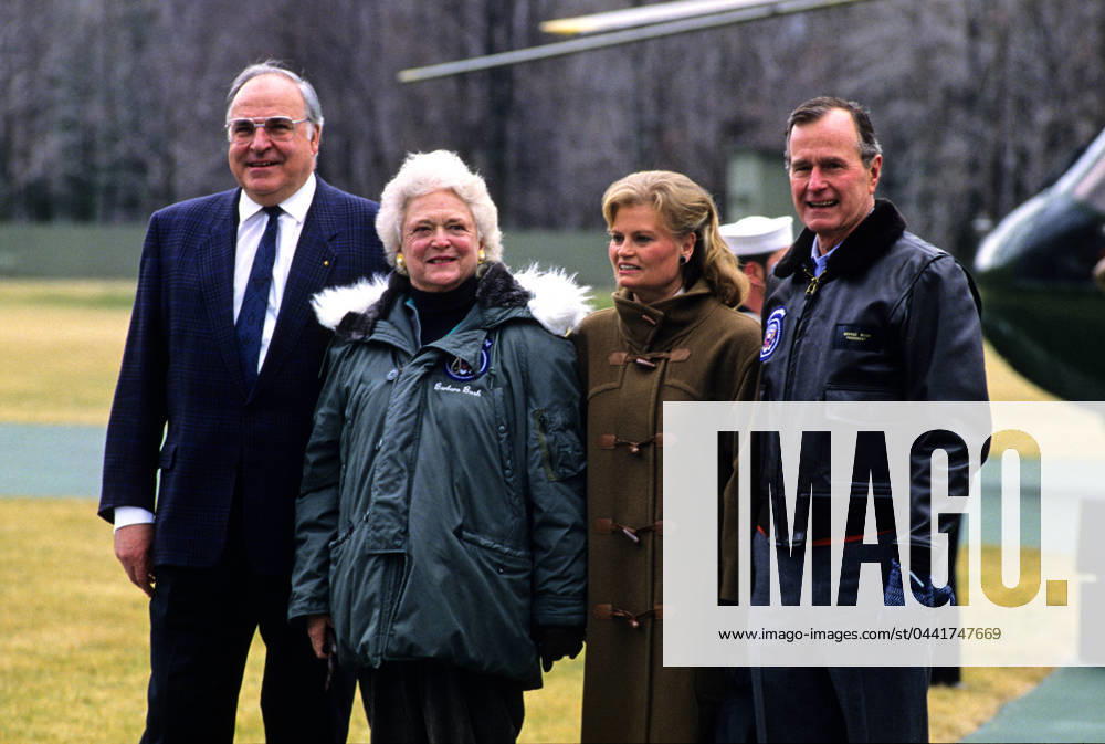 Bush Welcomes Kohl United States President George H.W. Bush, right, and first lady Barbara Bush, left center, welcome Chancellor Helmut Kohl of West Germany, left, and his wife, Hannelore, right center, to Camp David, the presidential retreat near Thurmont, Maryland on February 24, 1990. Credit: Ron Sachs CNP Thurmont Maryland United States of America