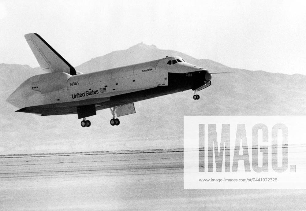 SHUTTLE ENTERPRISE, 1977. The Space Shuttle Enterprise comes in for a landing after completing a flight test at Edwards Air Force Base, California, September 1977.