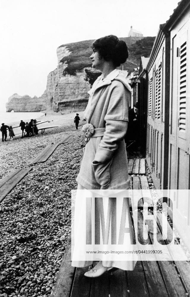 GABRIELLE COCO CHANEL (1883-1971). French fashion designer. Photographed on the beach in Etretat, Normandy, early 20th century. In the background is the cliff, Falaise d Amont.