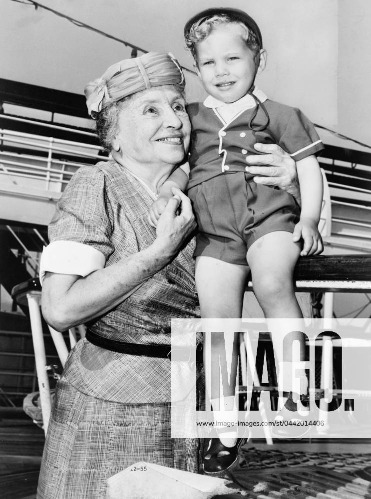 HELEN ADAMS KELLER (1880-1968). American writer and lecturer. Helen Keller with two-year-old Donald Hart on board the ocean liner Independence, after the ship docked in New York City. Photograph by Ed Ford, c1956.