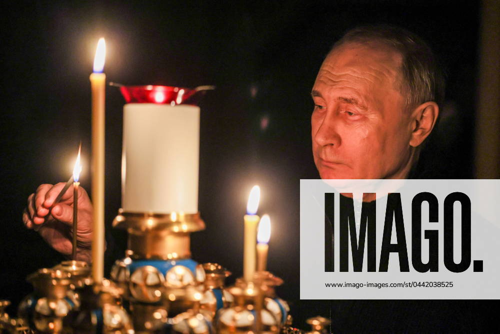 Russia s President Vladimir Putin lights a candle to commemorate victims of a terrorist attack on the Crocus City Hall. Mikhail Metzel Russian Presidential Press and Information Office TASS 68503936
