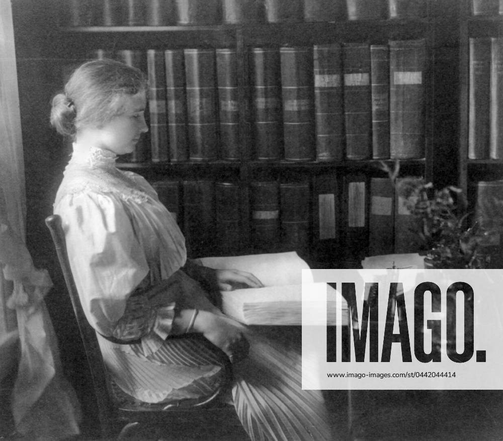 HELEN ADAMS KELLER (1880-1968). American writer and lecturer. Photographed reading braille