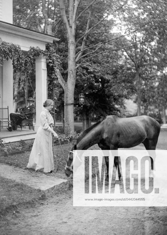 HELEN ADAMS KELLER (1880-1968). American writer and lecturer. Photographed holding reins to a horse, c1907.