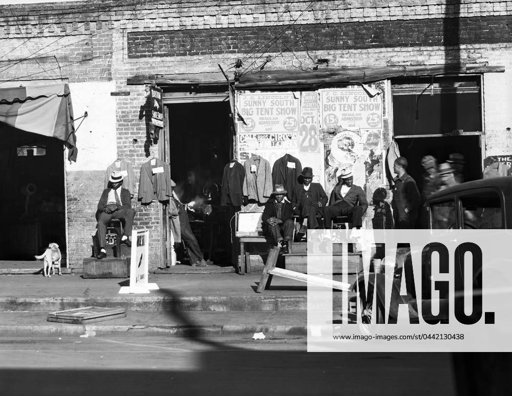 ALABAMA: BOOTBLACKS, 1935. African American bootblacks in front of a shoeshop in Selma, Alabama. Photograph by Walker Evans by December 1935.