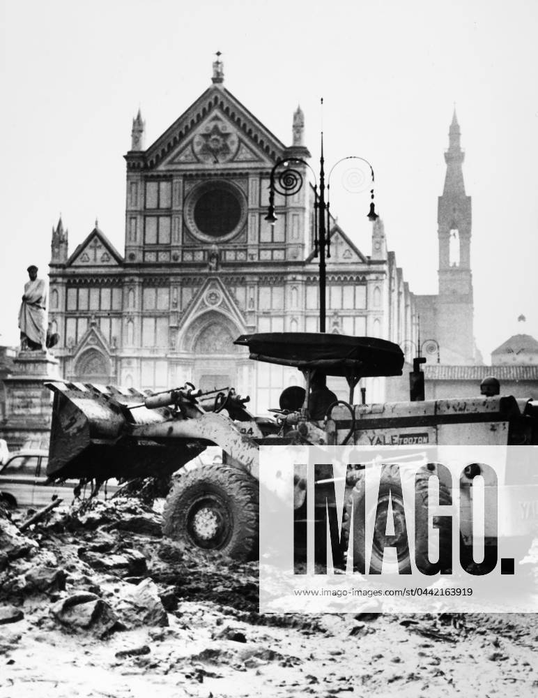 FLORENCE: FLOOD, 1966. A bulldozer clearing mud and debris from a street in front of the Basilica of the Holy Cross in Florence, Italy, after the flood of the Arno River